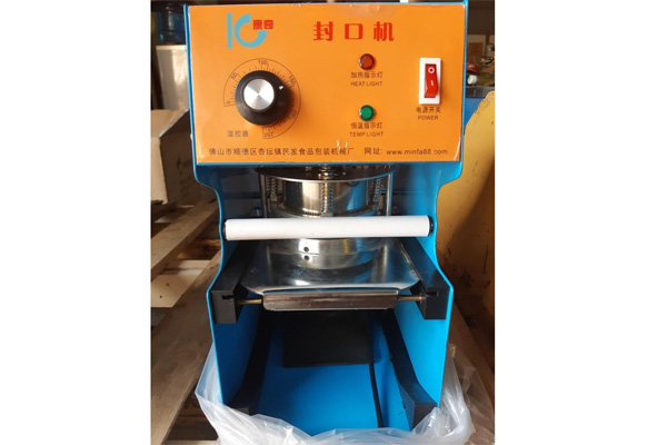 Máy dán miệng cốc IC-27